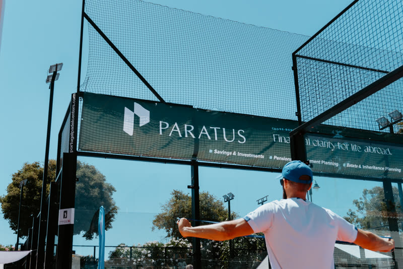 A player in front of a large Paratus Wealth banner reading Financial clarity for life abroad